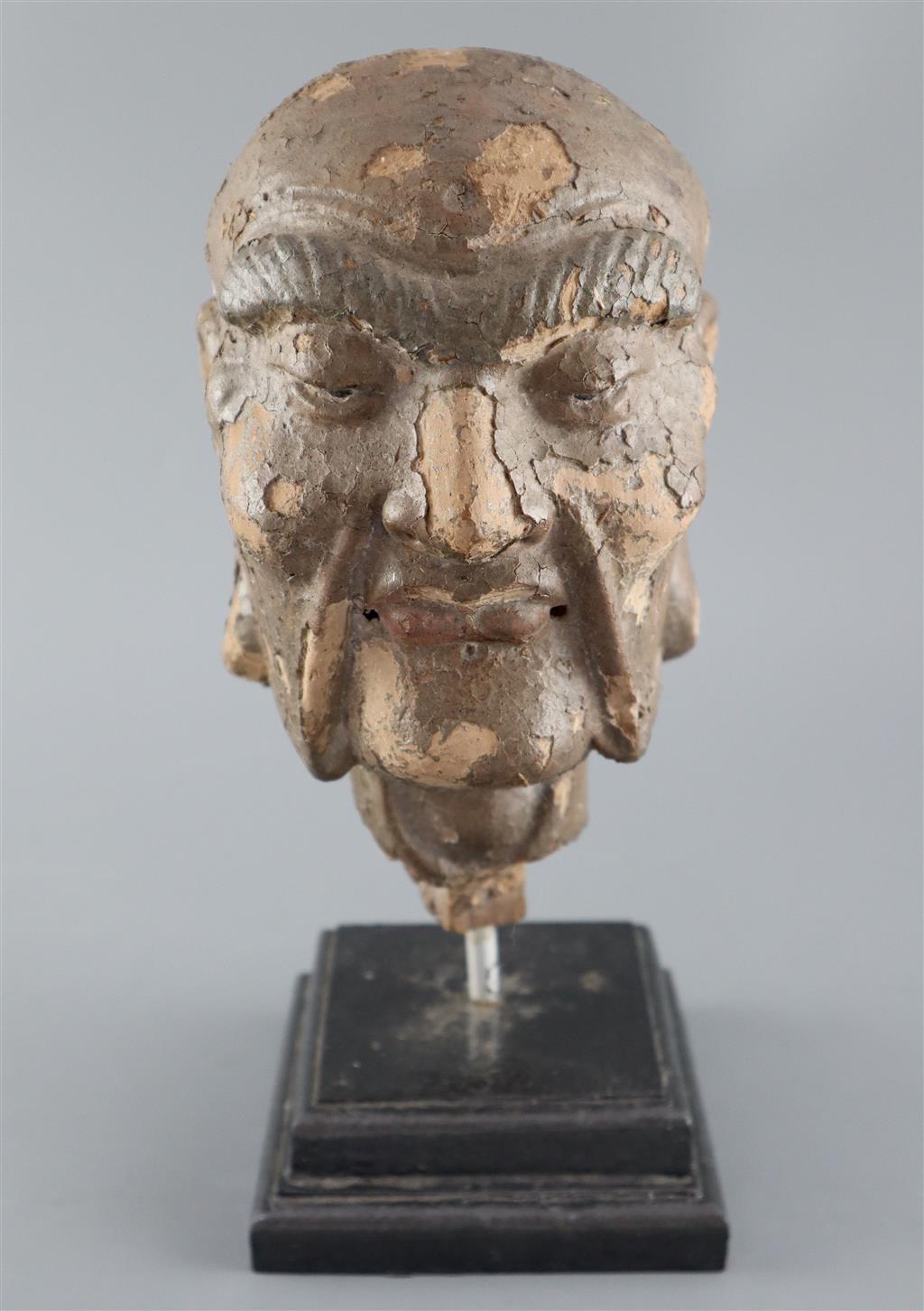 A Chinese clay and wood head of a luohan, possibly Song dynasty, 29cm high